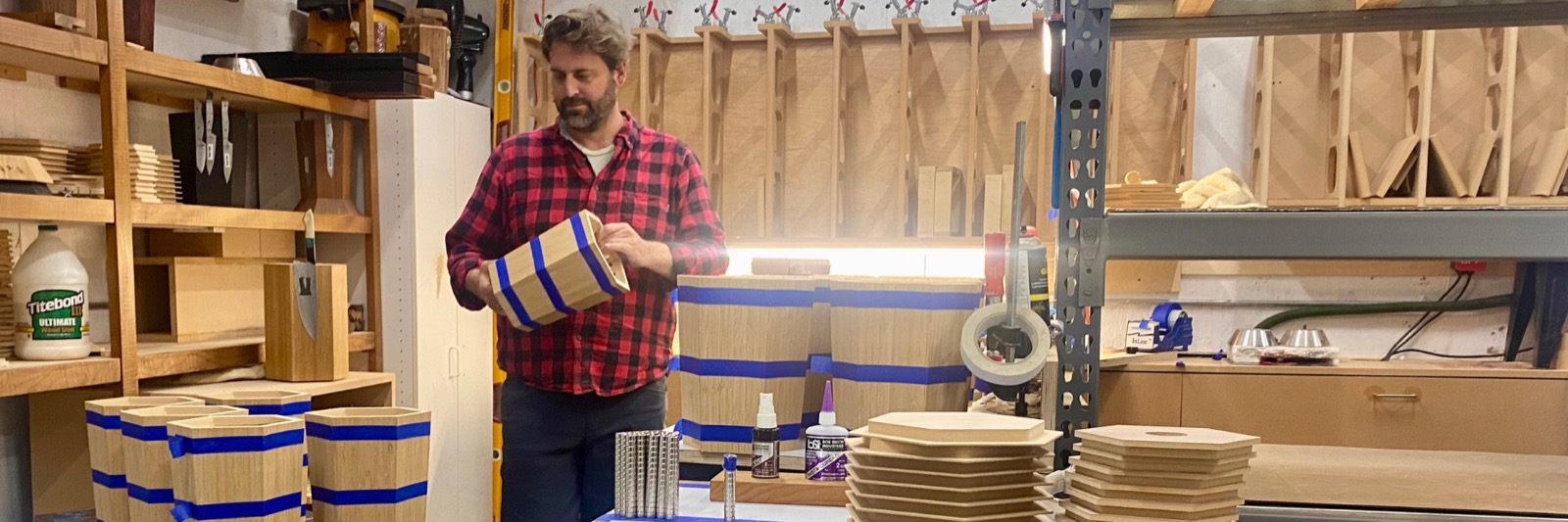 Henry assembling wooden knife blocks in the workshop